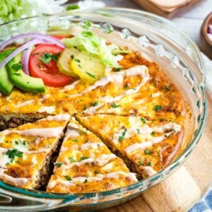 Bacon cheeseburger crustless quiche in a glass pie plate