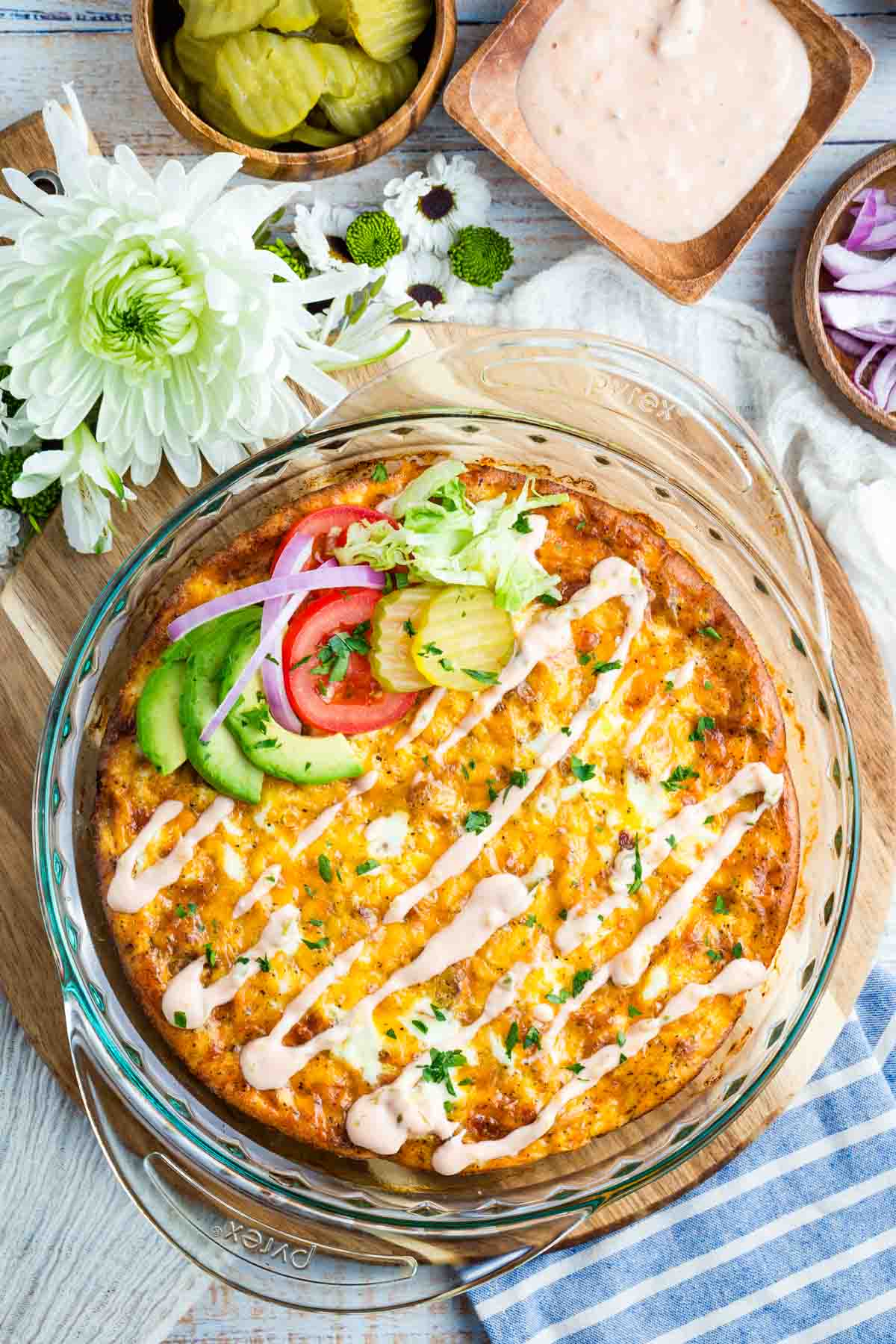 Bacon Cheeseburger Crustless Quiche is made with ground beef, bacon, and cheese, plus your favorite burger toppings. Overhead view of a bacon cheeseburger crustless quiche