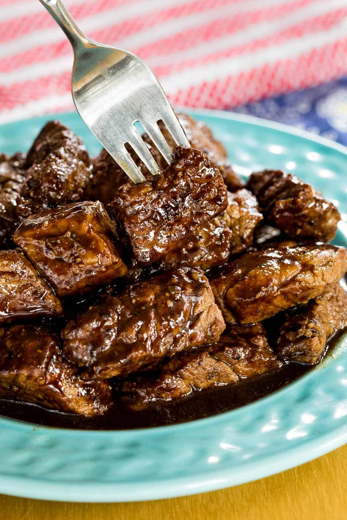 Honey Balsamic Glazed Steak Bites being picked up with a fork