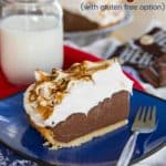 A slice of s'mores pudding pie on a blue plate next to a fork, with the words "S'mores Pudding Pie" in the top right corner of the image.