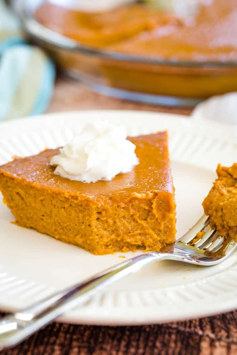 Crustless Pumpkin Pie with a bite taken from a slice