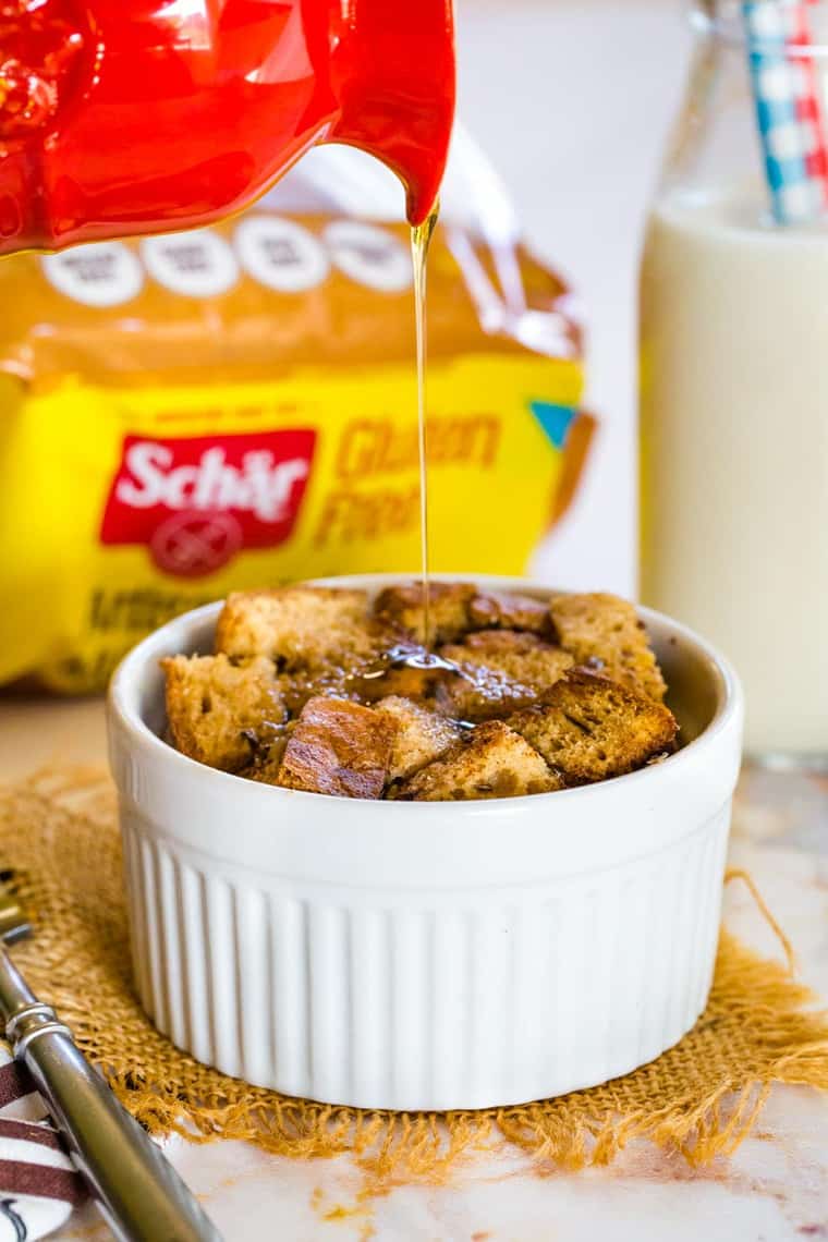 Pouring syrup over a mini French Toast Casserole Make with Schar Gluten Free Bread