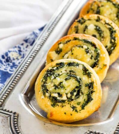 A serving plate of Spinach Feta Appetizer Pinwheels.
