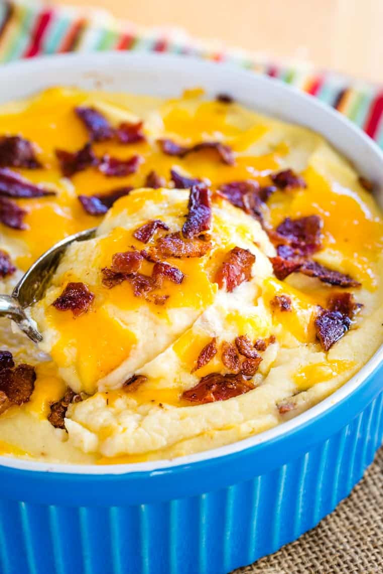 Low Carb Cheesy Mashed Cauliflower Bake in a blue casserole dish