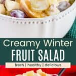 Two photos of a bowl of fruit salad coated in a yogurt dressing divided by a green box with text overlay that says "Creamy Winter Fruit Salad" and the words fresh, healthy, and delicious.