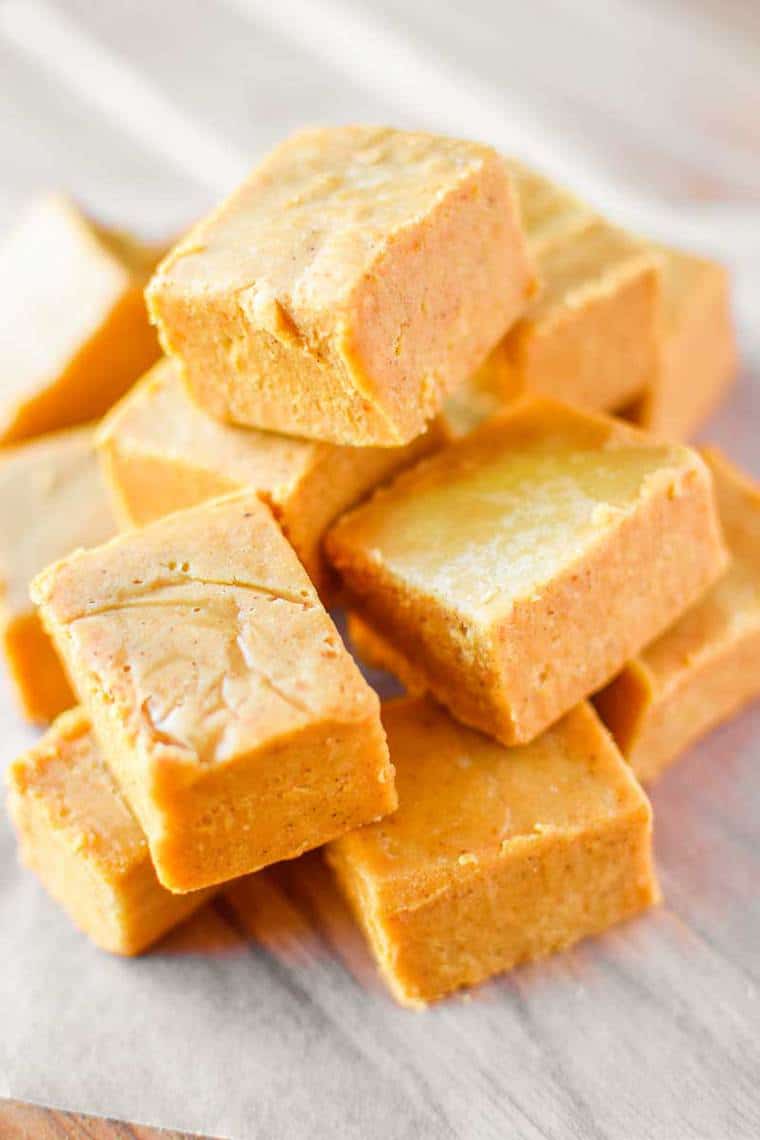Squares of peanut butter pumpkin fudge.