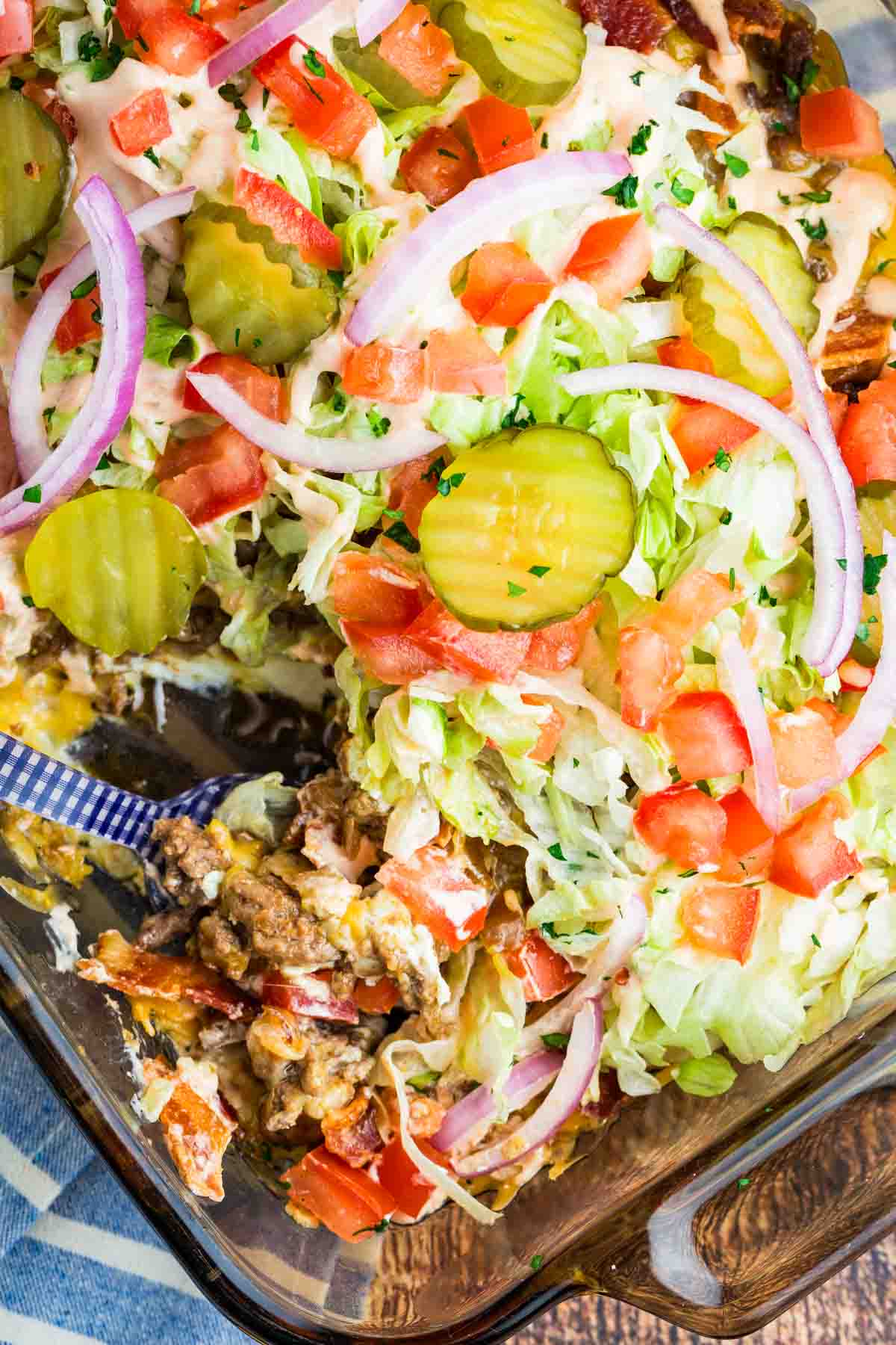 A spoon in bacon cheeseburger dip