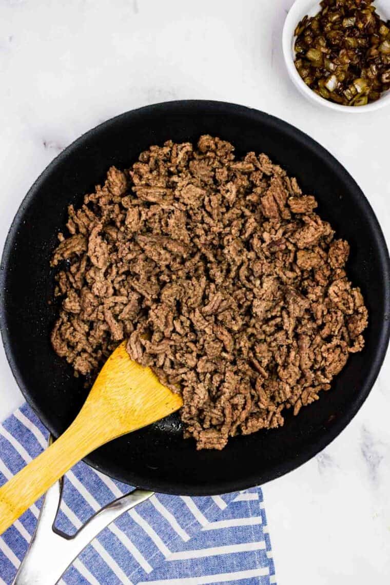 Stirring ground beef in a skillet
