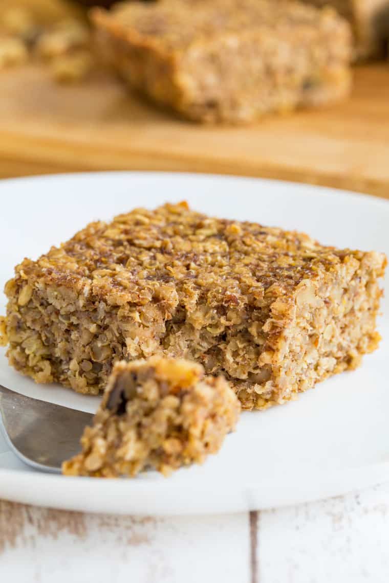 Banana Quinoa Breakfast Bar on a plate with a bite on a fork in front