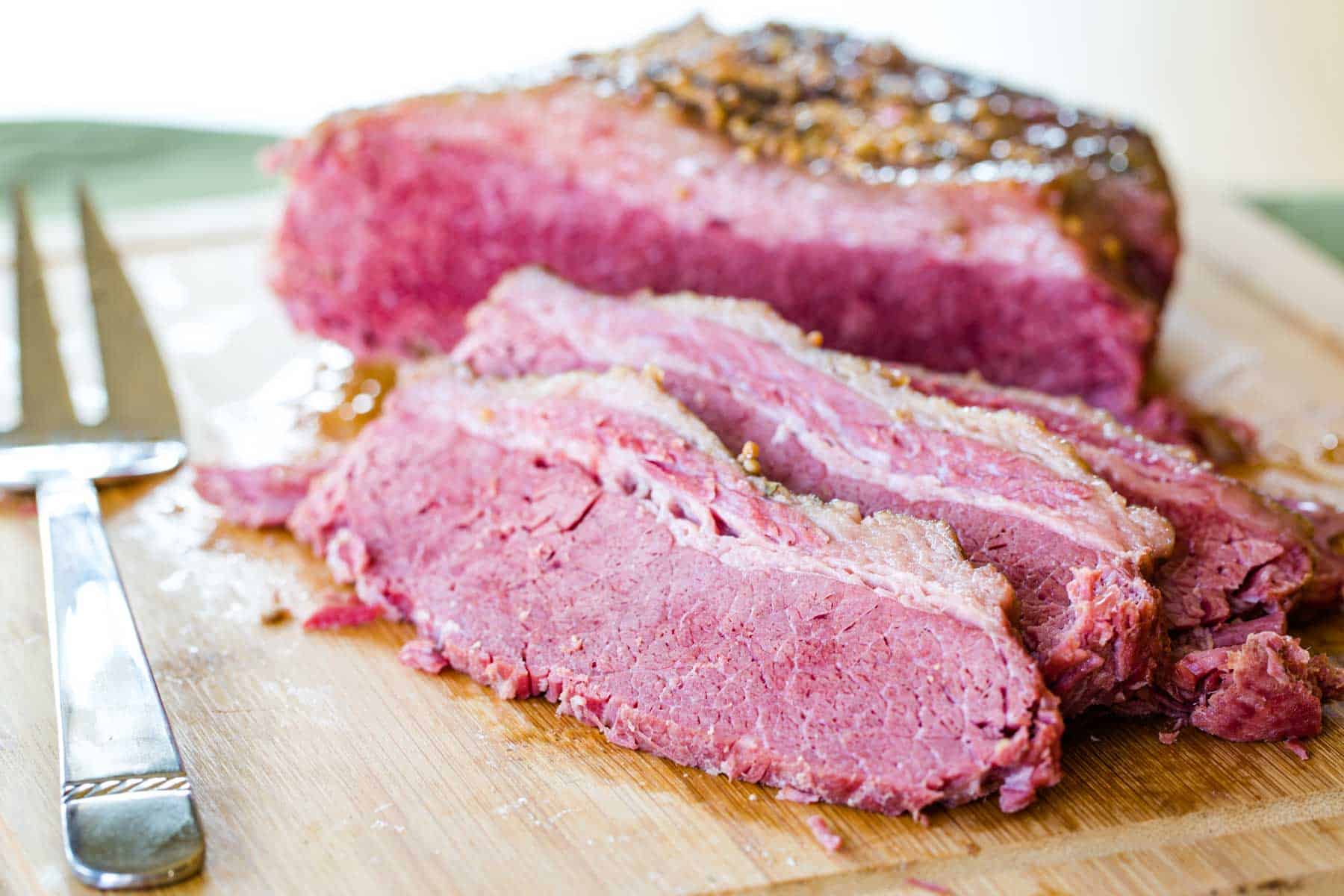 Tender, cooked corned beef brisket that has been sliced into thin pieces.