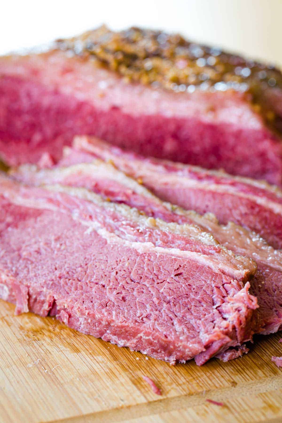 Tender, cooked corned beef brisket that has been sliced into thin pieces.