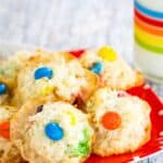 Coconut Macaroons with M&M's chocolate candies on a red plate.