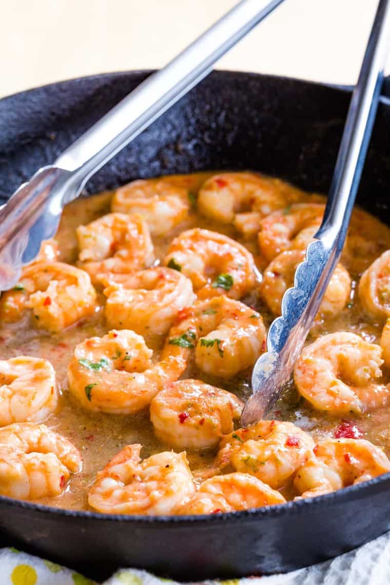 Chili Honey Lime Shrimp in a Cast Iron Skillet with tongs