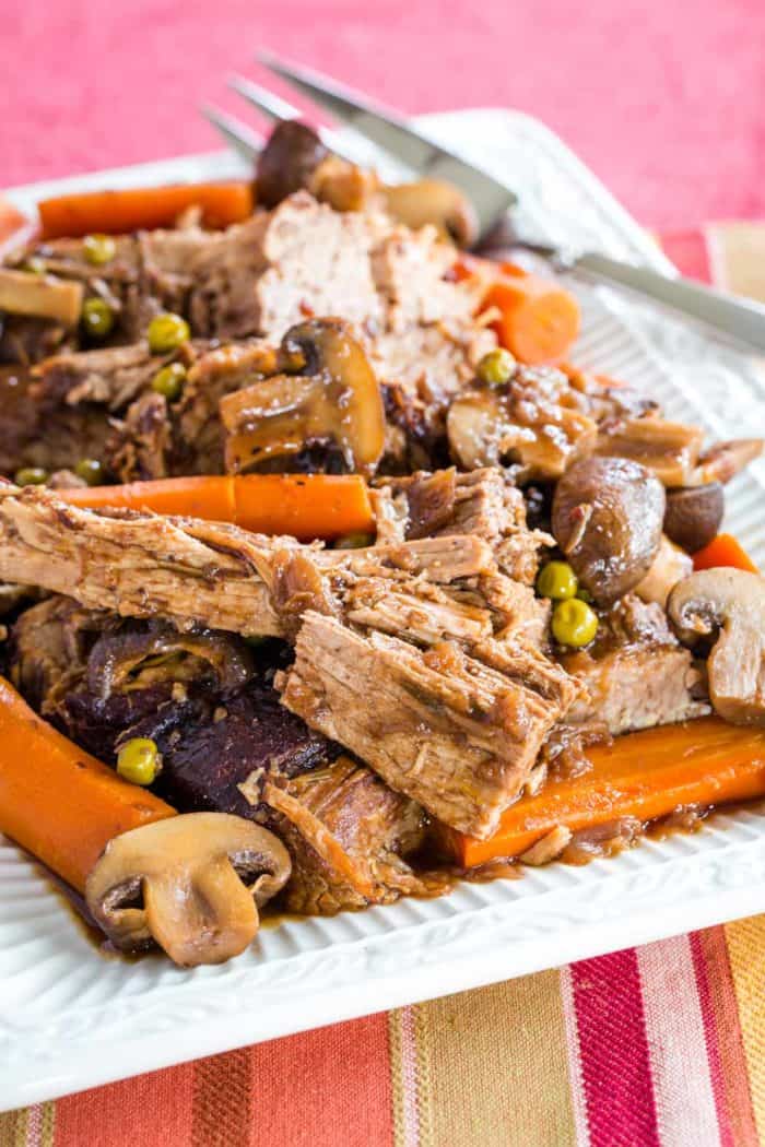 Slow Cooker or Instant Pot Pot Roast with Mushrooms recipe served on a rectangular platter