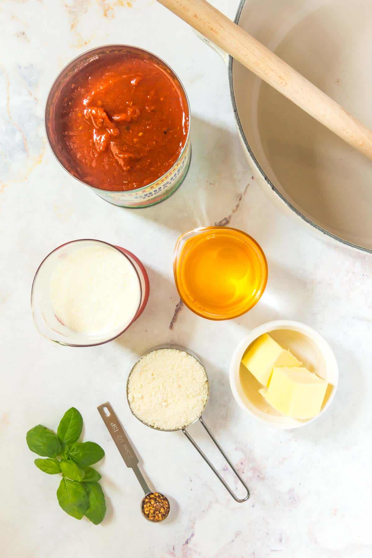 Small bowls with ingredients for vodka sauce