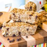 Banana Chocolate Chip Peanut Butter Granola Bars stacked on a cutting board
