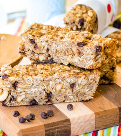 Banana Chocolate Chip Peanut Butter Granola Bars stacked on a cutting board