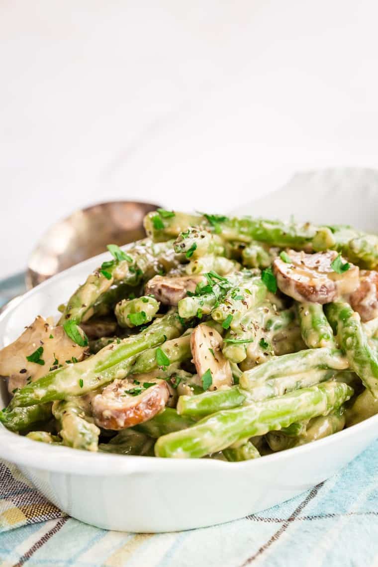 Creamy Green Beans and Mushrooms in a white serving dish