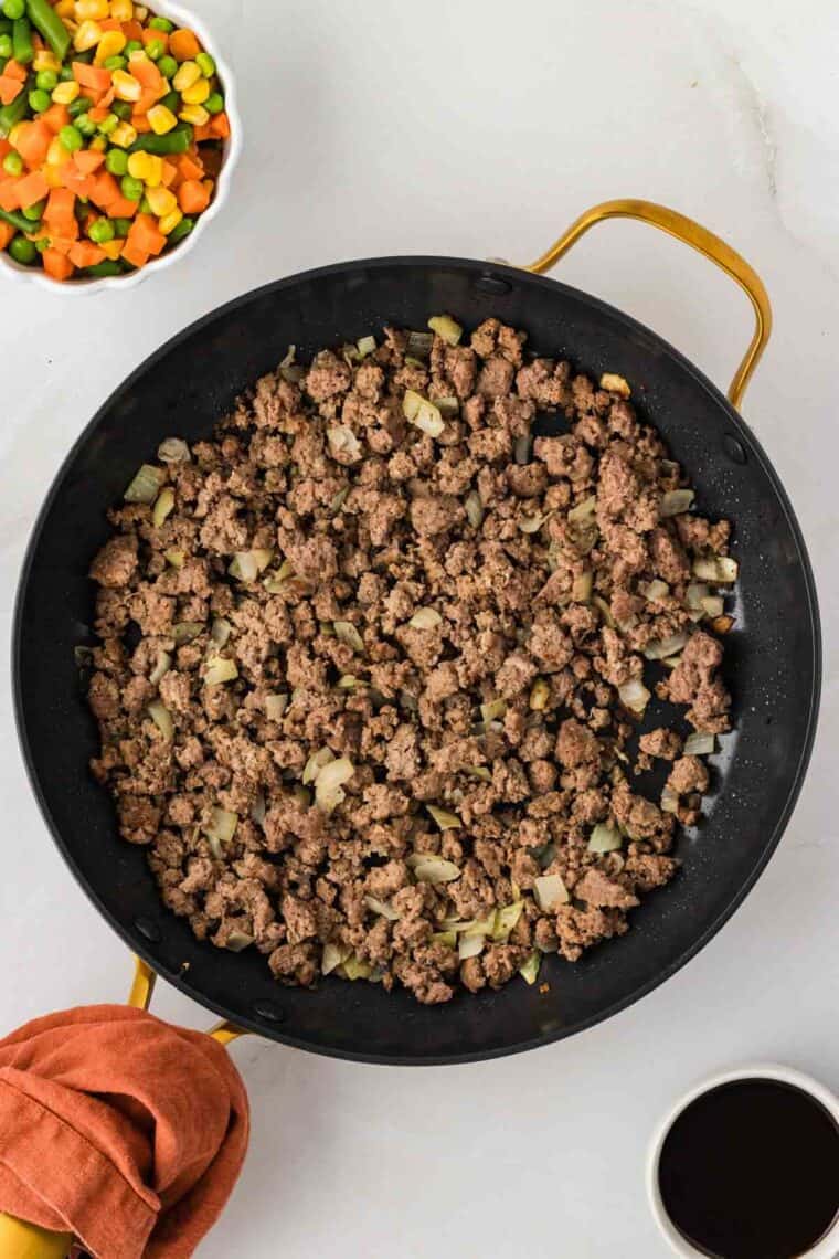 Browned ground beef in a skillet