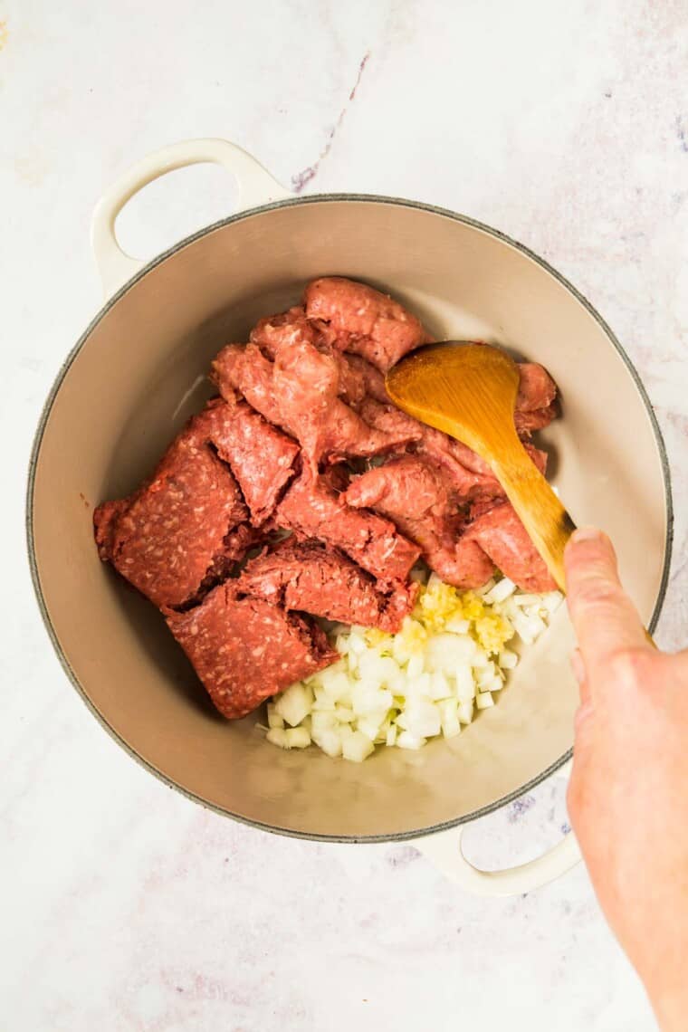 Add ground beef, sausage, onion and garlic to pot
