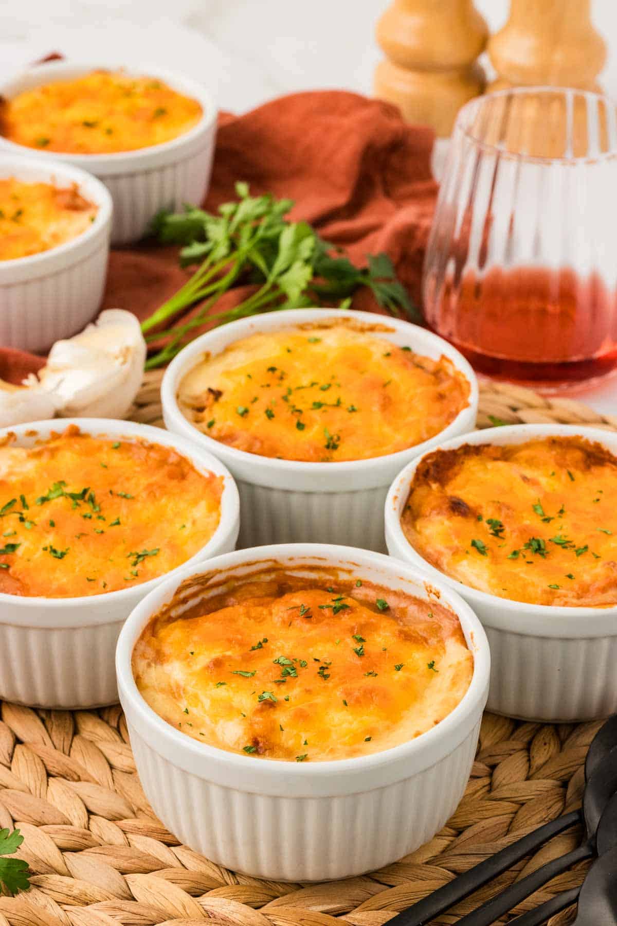 Four mini shepherd's pies on a placement