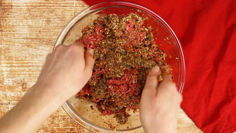 Mixing meatloaf in a bowl