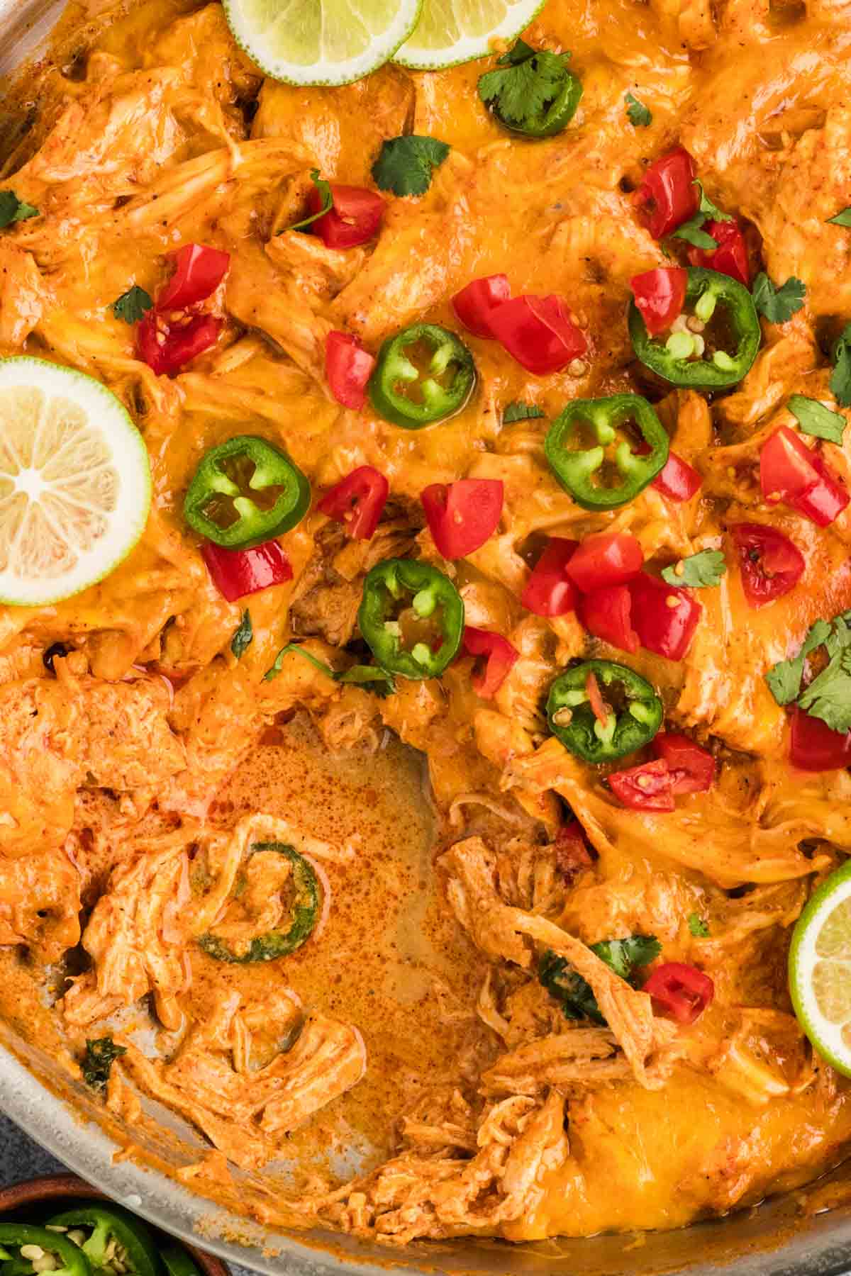 Close overhead view of a chicken enchilada skillet dinner