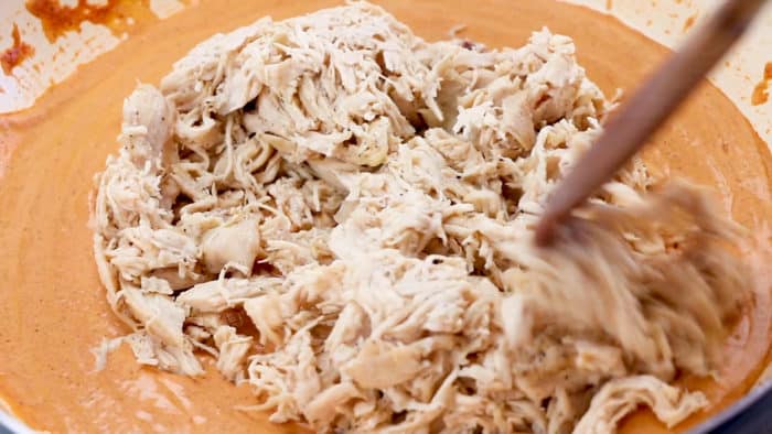 Stir shredded chicken into creamy enchilada sauce