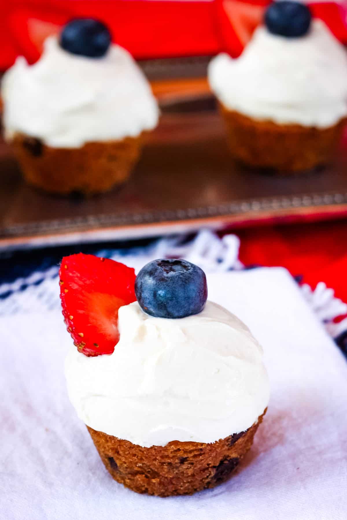A berry cookie cup on a white plate