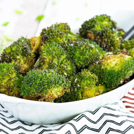Roasted Broccoli with Soy Sauce and Sesame Seeds in an oval serving dish