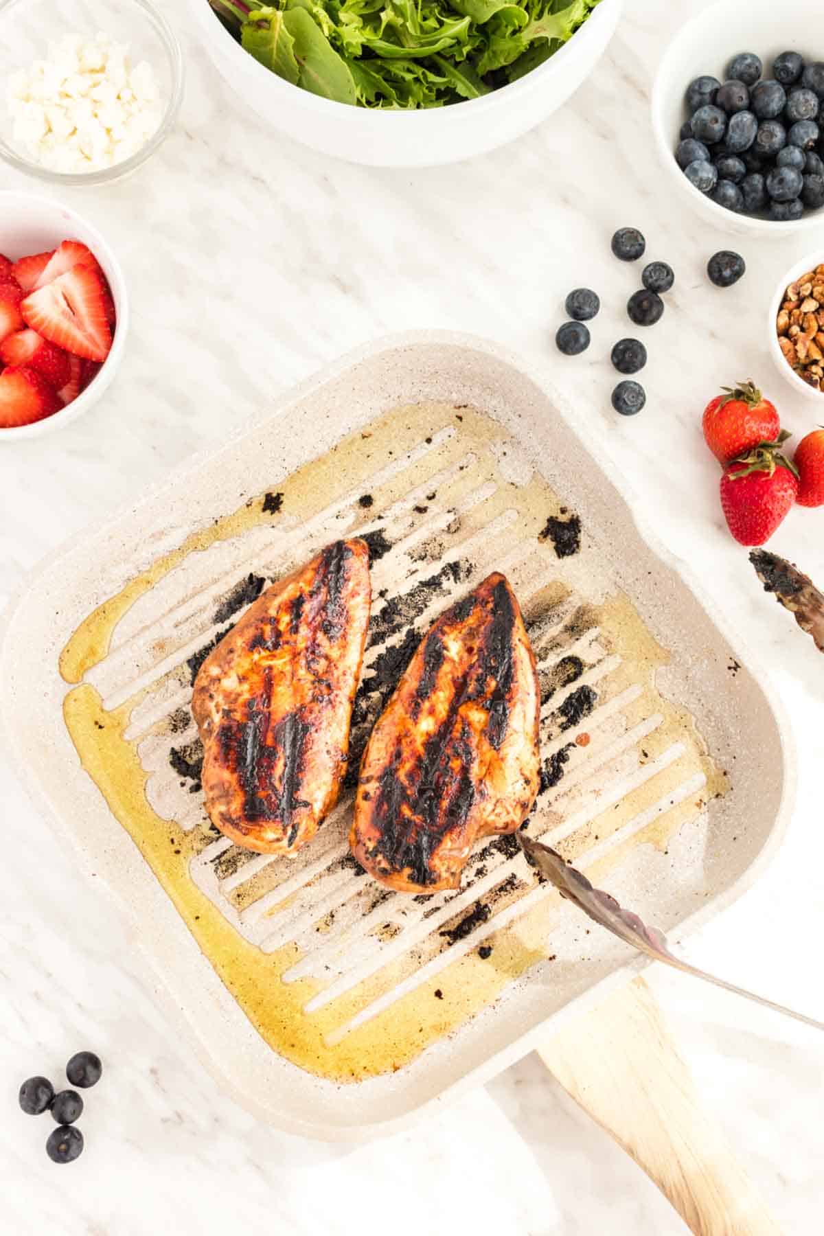 Blueberry Balsamic Marinated Grilled Chicken in a grill pan