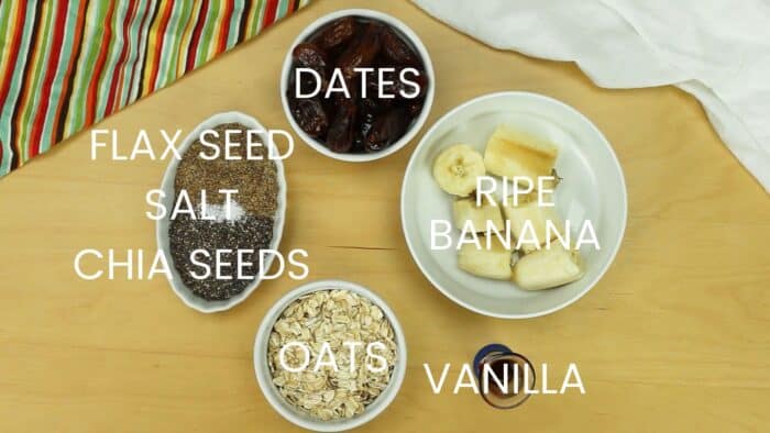 Labeled ingredients for Chunky Monkey Energy Balls including Date, Banana, Vanilla, Oats, Flax Seed, Chia Seeds, and Salt