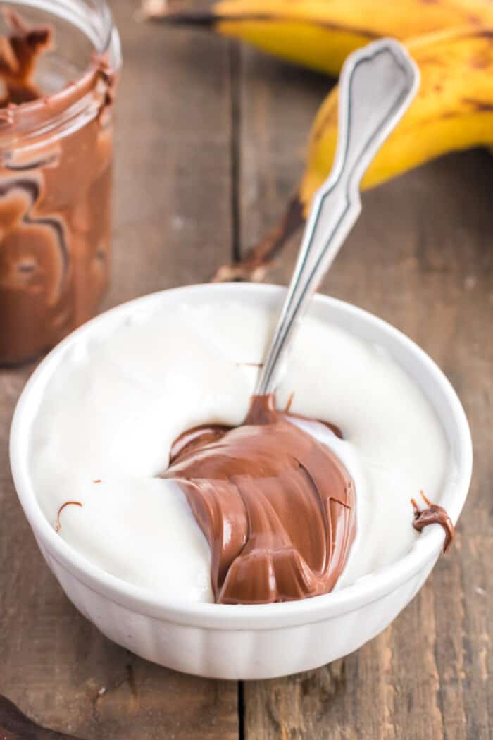 Bowl of vanilla yogurt and Nutella to mix together to make popsicles