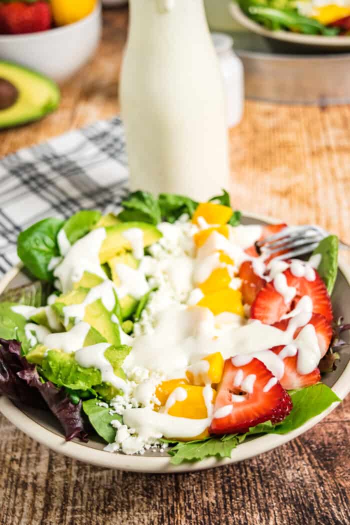 Mixed greens topped with strawberries, mango, avocado, goat cheese, and honey lemon lime dressing