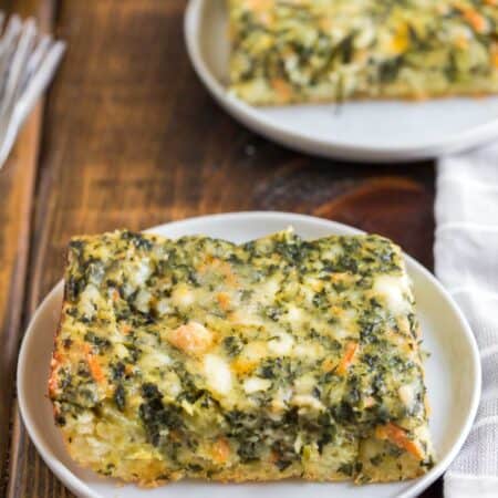 Glass casserole dish with Cheesy Spinach Breakfast Bake