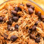 Slow Cooker Salsa Chicken and Black Beans in a glass bowl