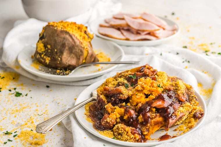 Baked Sweet Potatoes stuffed with turkey and cranberry barbecue sauce on a plate