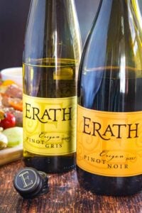 Bottles of Erath Pinot Noir and Pinot Gris with bottle caps