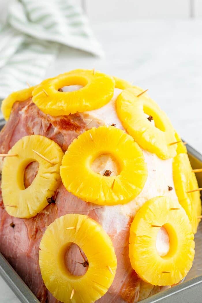 Pineapple rings attached to the ham with toothpicks
