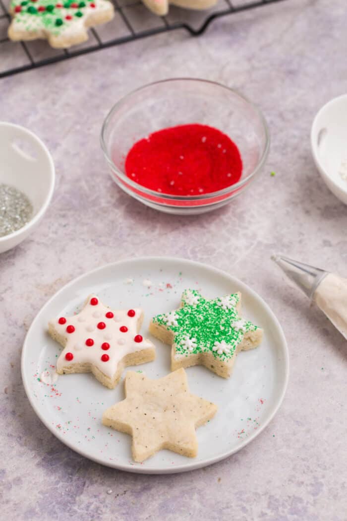 Two frosted and one unfrosted star-shaped gluten free chai cut out cookies