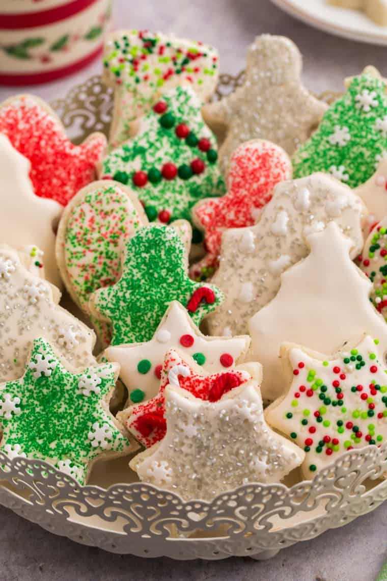 Decorated gluten free sugar cookies stacked in a decorative serving platter