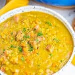 An overhead view of a bowl of split pea soup with text overlay that says "Ham & Split Pea Soup".