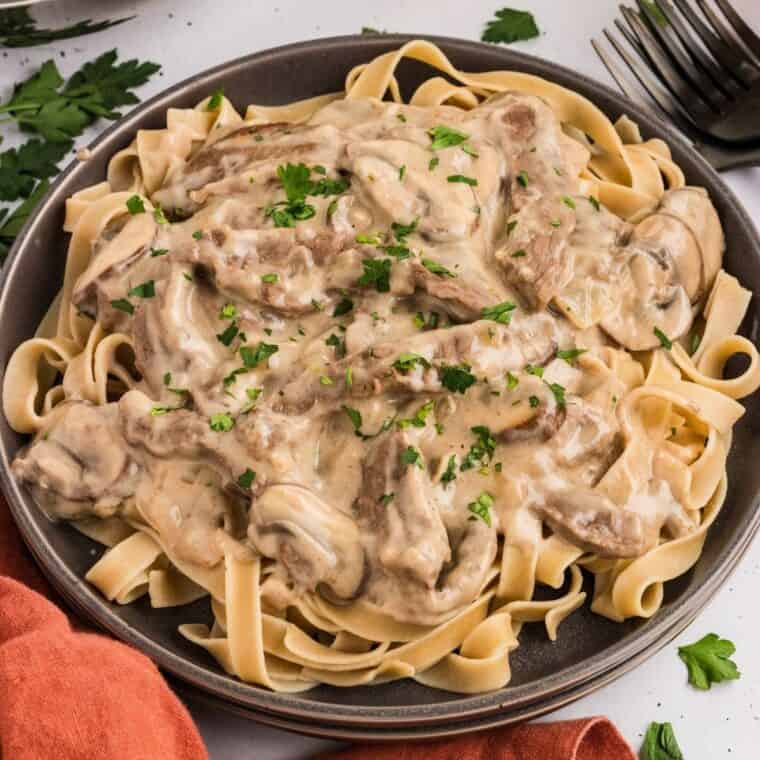 Gluten free beef stroganoff on a black plate