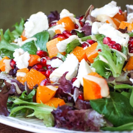 Colorful salad piled on a plate