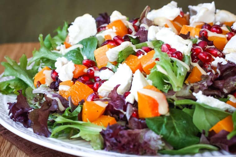 Colorful salad piled on a plate