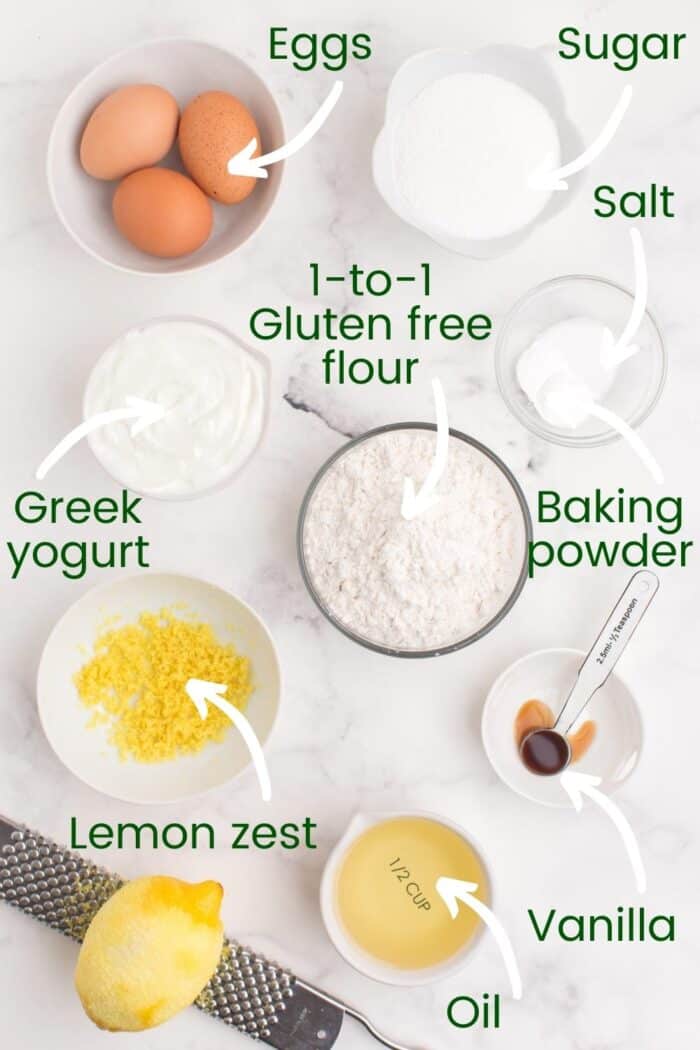 Bowls holding eggs, sugar, salt, gluten free flour, baking soda, lemon zest, vanilla, and oil.