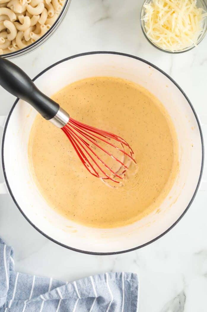whisk in the pot of thickened cream sauce