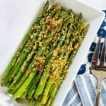 Air Fryer Asparagus with Parmesan on a white rectangle plate