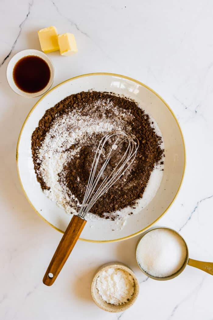 Gluten-Free Flour, Cornstarch and Cocoa Powder Being Whisked Together in a Bowl