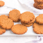 peanut butter cookies scattered on a rectangular platter